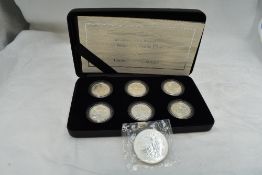A 2007 Britannia 20th Anniversary Silver Proof One Pound Coin in case along with a 1998 Two Pound