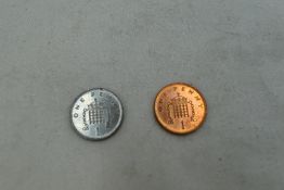 A 1999 GB copper plated steel One Penny, missing the copper plating in minting along with a