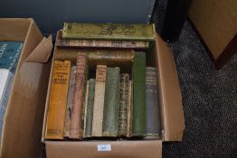 A collection of vintage books, including Alice in wonderland, Annuals and poetry.