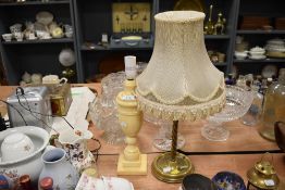 Two table lamps, one in brass the other marble effect.
