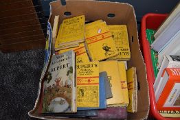 A box full of vintage Rupert books.