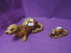 Two figures of otters by Wildlife studio
