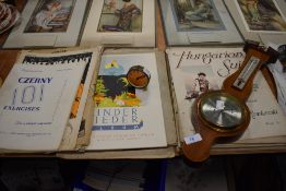 A aneroid barometer and a vintage metal Oris Alarm clock.
