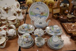 A part Lithopane tea set having silver gilt accents,transfer and hand painted details, including