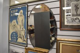 A vintage wooden backed large oval bevelled edge mirror.