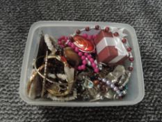 A small selection of costume jewellery including strings of beads, bangles, loose beads etc