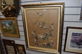 An oriental embroidery on silk, some damage to silk but an eye catching example no less.