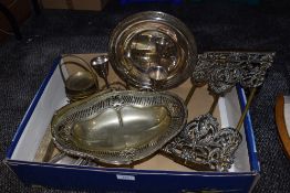 A vintage foldable brass book stand having ornate ends and a selection of plated ware also two