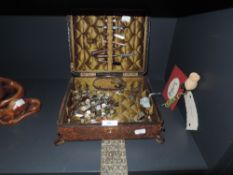 A leather bound sewing or embroidery case with some original contents
