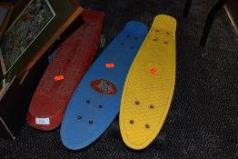 Three plastic banana boards.