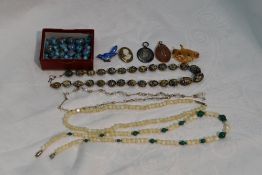 A small selection of costume jewellery including enamelled brooch in form of a bird, murano style
