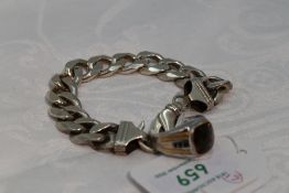 A lady's white metal curb chain bracelet stamped 925 of chunky form having dog leash clasp, and a
