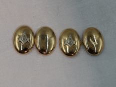 A pair of yellow metal cufflinks stamped 10K of oval form bearing the Masonic emblem, approx 4.5g