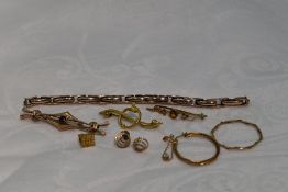 A selection of 9ct gold and yellow metal jewellery including watch strap stamped 9ct, odd