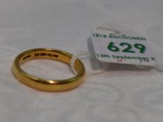 A 22ct gold wedding band of plain form, approx 8.3g & size U
