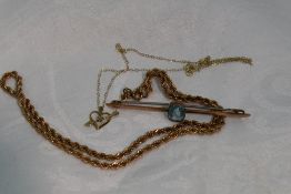 Three pieces of yellow metal jewellery including a bar brooch stamped 9ct having paste stone, rope