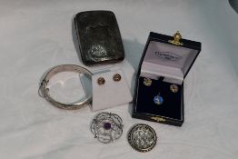 A selection of HM silver and white metal jewellery including hinged bangle, brooches earrings and