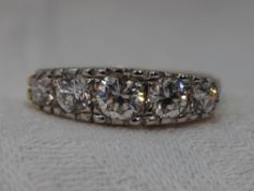 A lady's dress ring having five graduated cubic zirconia in a pave set 'I love you' mount on an 14ct