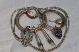 A small selection of silver and white metal jewellery including plannished bangle, multi strand