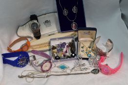 A selection of costume jewellery and wrist watches including cuff bangle, Paua shell jewellery,