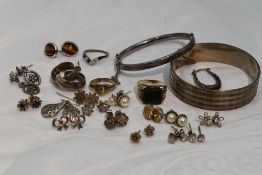 A small selection of white metal & HM silver jewellery including bangles, rings and stud earrings,