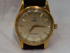 A gents 18ct gold Omega Seamaster automatic wrist watch no: 18293220, having a baton numeral dial to
