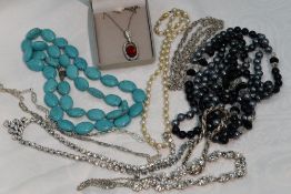 A small selection of jewellery including HM silver and white metal chains, diamante, string of