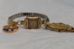 A lady's vintage 9ct gold wrist watch having Arabic numeral dial to square face in 9ct gold case