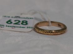 A rose gold wedding band stamped 9ct having engraved decoration, size Q & approx 3.7g