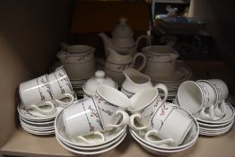 A canon Z135 film camera, a collapsible walking stick and an alarm clock.