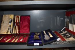 A selection of vintage canteens of cutlery including fish knifes and forks.