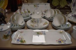 A 1930s Shelley 'Wild Flowers' part tea service, having Gainsborough shaped cups, saucers,sandwich