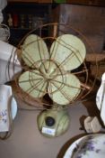 An original art deco mint green electric desk fan.