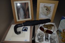 A miscellany of items, including pictures, umbrella and more.