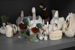 A collection of ceramic ducks and swans.