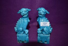 A pair of vintage Chinese Foo dogs/Guardian lions, in a vibrant Azure blue finish.