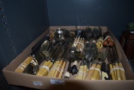 An array of mixed vintage and antique cutlery, various uses and styles.