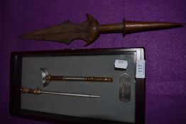 A cased warriors miniature ceremonial sword and Indian styled dagger with chased copper handle.