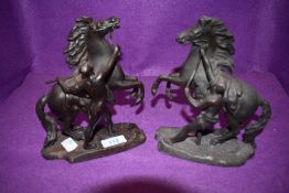 A pair of bronzed spelter figures, Horse and charioteer in Marley style after Coustou.