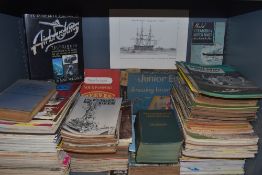 A shelf full of engineering magazines and similar an a boxed Junior engineers drawing board and