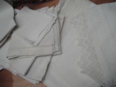 A selection of antique huckaback towels, cotton lace edged shelf linings,tray cloths and similar.