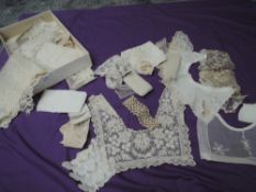 An assortment of lacework and embroidery, various techniques used through these intricate pieces,