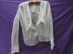 An Edwardian tulle blouse having lace and fine pin tucks to large sailor style collar and back of