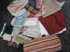 An array of of high quality upholstery fabrics, lining fabrics and swatches, including wool and