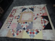 A large and colourful late antique patchwork quilt, around a double in size, some wear and marks