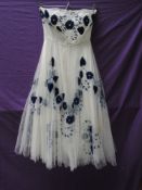 A vintage 1950s strapless layered tulle dress having blue velvet appliqué to top layer, possibly