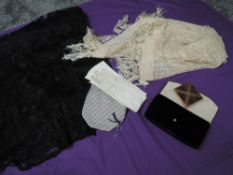 A small lot containing two antique shawls one with fringing, a beaded drawstring bag a pair of kid
