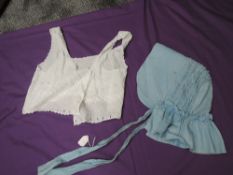 A blue cotton Victorian bonnet in good condition, also included is a camisole cover having intricate