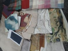 A box full of high quality upholstery fabrics, lining fabrics and swatches.