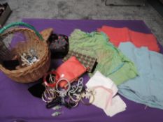 A basket full of vintage and antique items including costume jewellery, handkerchiefs and case,